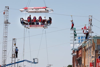 Diners were served barbecue platters in a pop-up restaurant that was suspended 40 feet in the air. Waiters walking on tightropes carried the meals on Dixie Ultra paper plates.