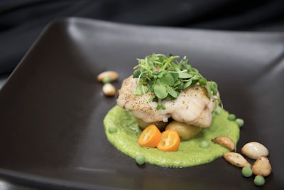 Pan-seared monkfish with roasted garlic, new potatoes, and truffled spring pea sauce, by MK Catering in Hyattsville, Maryland