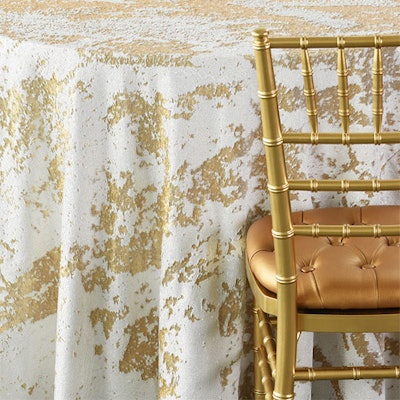 Miami-based Nuage Designs recently launched a new collection of table linens inspired by mixed metals. The sequin “Koi” pieces feature a texture and pattern similar to the fish skin and are available in white and silver, white and gold, beige and gold, and black and gold. The items range in price from $85 to $95, depending on the size of the linen.