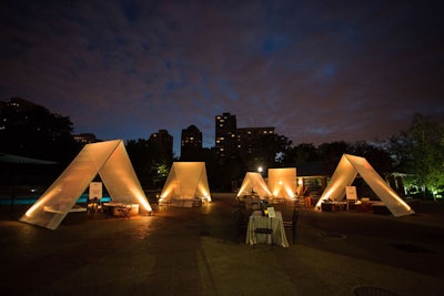After dinner, guests retreated to a 'glamping' theme after-party. The custom 12-by-14-foot tents were filled with custom benches by Fragrant Design, as well as directors chairs and decorative lanterns. Each tent had a dedicated server for food and drink service.