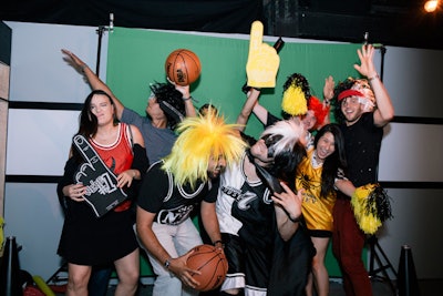 A locker room featured a photo booth with a lot of sporty props.