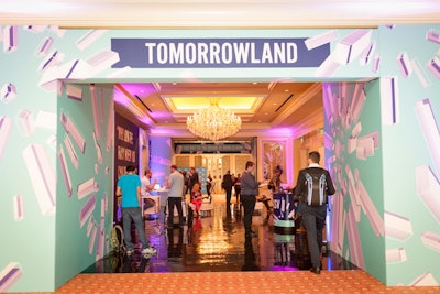A freestanding frame wrapped with tension fabric created a colorful entrance to the Tomorrowland area.