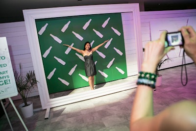 Guests posed for photos at a Heineken activation, and the guests' photos were then incorporated into the decor.