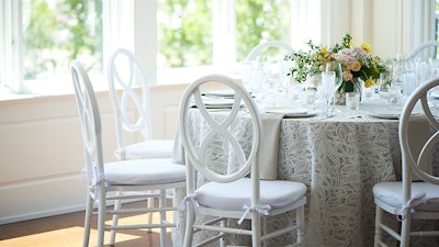 Xavier White Chair is a classic silhouette re-imagined in a bright white finish for a versatile elegance.