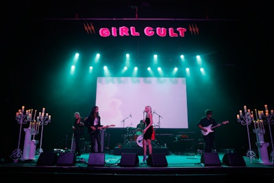 The indoor space—dubbed the “Goddess Stage”—was designed to have a gothic, edgy vibe, with white columns, candelabras, and colorful lighting and signage.