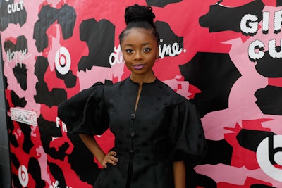 Various step-and-repeats throughout the theater created girly photo ops for attendees such as Skai Jackson (pictured). Other backdrops included a pink fuzzy wall.