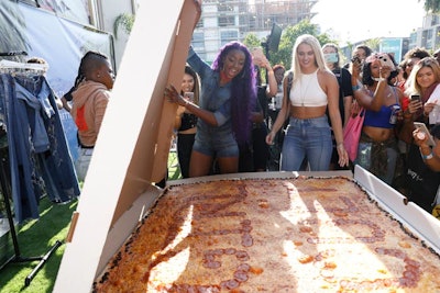 In the rooftop space—dubbed the “Queen Stage”—sponsor Nasty Gal surprised attendees with a massive pizza from Big Mama's & Papa's Pizza that spelled the words “Girl Cult” in pepperoni.