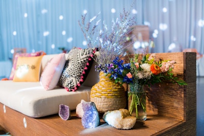 The after-party took on a bohemian theme, complete with patterned rugs, eclectic throw pillows, and crystals as decor.