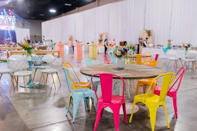 Seating options at the closing party were a mix of colorful chairs, funky ottomans, swing chairs, and branded throw pillows on the floor.