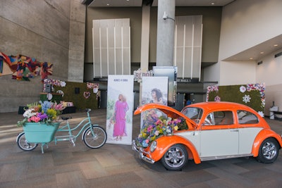 As guests entered the South Towne Expo Center for the daytime conference, held from July 20 to 22, they were greeted with bright, on-theme touches such as a vintage VW bug, floral installations by the Flower Affair, and a photo-op-friendly bike from Madsen Cycles.