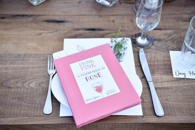At the July 20 dinner, Drink Pink books by Victoria James adorned each place setting.