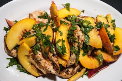 Chef Melia Marden of the Smile in New York prepared a four-course meal, which included a roasted eggplant dip with grilled flatbread, an heirloom tomato and lobster salad, and grilled chicken paillard with nectarine, mint, parsley, and aleppo pepper (pictured).