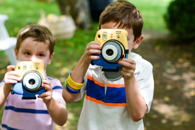 Upon arrival, kids were offered special Fujifilm Minion Instax mini 8 instant film cameras. Pre-loaded with film, they were used throughout the event to capture favorite moments, have fun, and add a further festive touch to the event. Guests were allowed to keep their cameras as a keepsake.