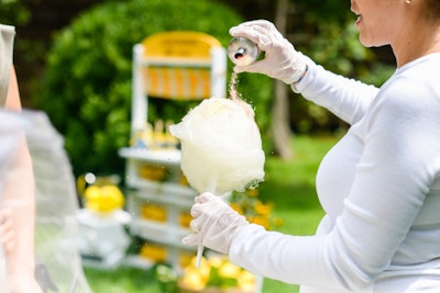 New York City-based artisanal cotton-candy catering company Fluff and Fluff was on hand to create custom sugary treats for children and adults alike. The yellow cotton candy, in passion fruit and mango flavors, was made with organic cane sugar and was offered plain or with a series of natural flavors, colors, and toppings, including pop rocks, rainbow sprinkles, raspberry pixie dust, or simple sparkles.