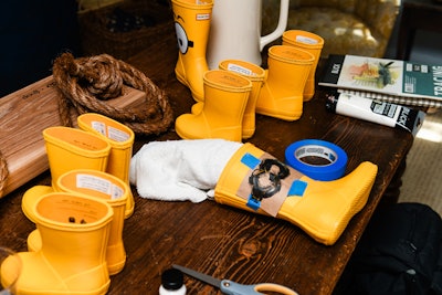 Inside the Goop MRKT pop-up store, artist Tyler Alexander was on hand to create custom Minion designs on yellow Hunter boots as well as a slip-on sneaker.