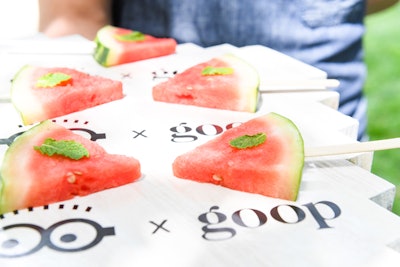 Watermelon on a stick was one of a bevy of cool treats offered to guests by Peter Callahan Catering. There was also mini avocado toast with toasted seeds, cold raspberries in wooden bowls, mini yogurt parfaits with fresh fruit, and apple sauce in mini loto glasses.