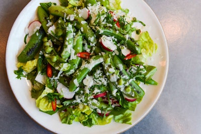 For the July 7 dinner, chef Dan Kluger of Loring Place in New York prepared a four-course meal, which included sugar snap peas and radishes with pecorino vinaigrette (pictured), a grilled strawberry salad with sungold tomatoes, cucumbers, and a red wine vinaigrette, and dry-aged ribeye with cherry tomatoes, garlic scapes, and maitake mushrooms.