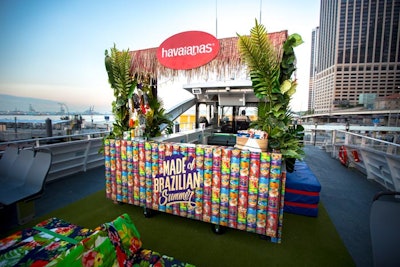 A branded tiki-style bar fronted with the company's global campaign logo offered up refreshments.