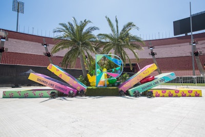 One of the most popular activations of the day was the Pandora Photo Moment—a giant, bright “P” built with dichroic glass and flanked by colorful dominos. Guests posed with summery emoji-type floats while brand ambassadors took photos.