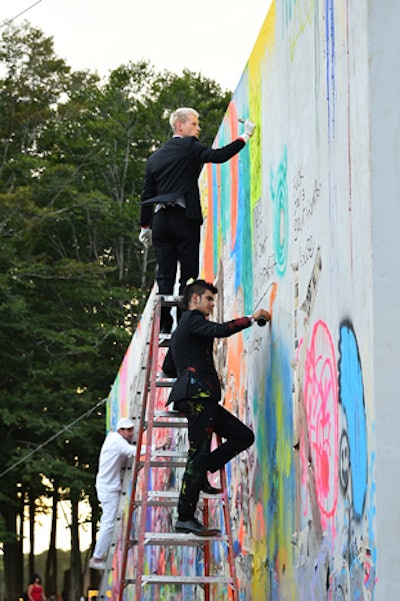 On the other side of wall, guests were invited to spray paint messages of political resistance. The graffiti wall by Jokubas Nosovas / Nikitas Broukakis & Sam Khoshbin entitled 'Too M@ch Talk,' was a colorful counterpoint to the black and white of the opposite side.