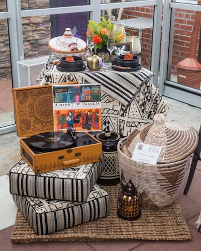 A Morocco-inspired turntable, a vinyl copy of Charlie Parker's A Night in Tunisia, and fabrics by Robert Allen Design transported guests to Africa.