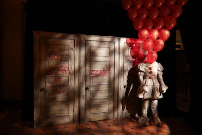 The red-balloon theme continued to a photo backdrop, which featured the words “scary” and “not scary at all” on a series of doors (another reference to a scene in the film). Guests used the area to take selfies with a clown mannequin, or pose with the Georgies.
