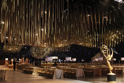 For all three Emmys dinners, Sequoia Productions created a massive ceiling installation made from 5,000 paper cylinders painted with biodegradable gold coloring.