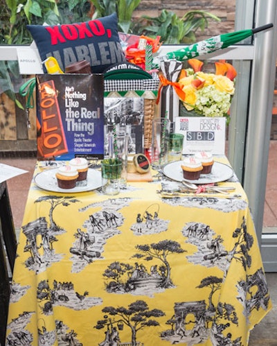 This basket honoring the Manhattan neighborhood of Harlem, by Sheila Bridges, included linen that addresses African-American stereotypes, products and services from the area, and—for the highest bidder—two tickets to Amateur Night at the Apollo. Jouy