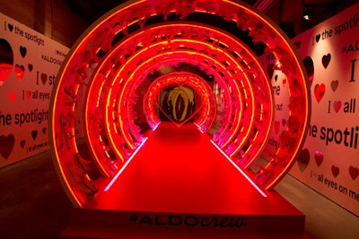 Aldo worked with Refinery29 to create “Love Walk,” a glowing runway surrounded by a coiled structure covered in nearly 250 shoes and pulsing light. The walls featured messages inspired by the brand's fall campaign.