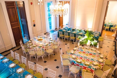 Colorful linens from DC Rental and arrangements from Philippa Tarrant Floral Design topped tables in the White-Meyer House reception hall for the seated dinner.