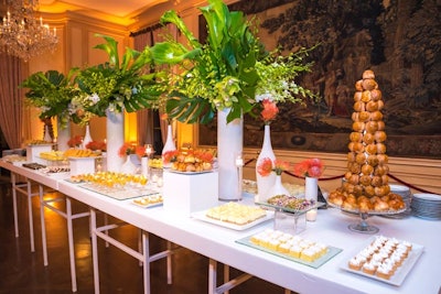 One of Meridian House’s formal rooms became the setting for a dessert table featuring Latin and tropical themed sweets, along with towering floral arrangements.