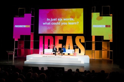 The Atlantic's editor in chief Jeffrey Goldberg interviewed Michele Norris, journalist and founder of the Race Card Project, in front of a colorful stage backdrop.