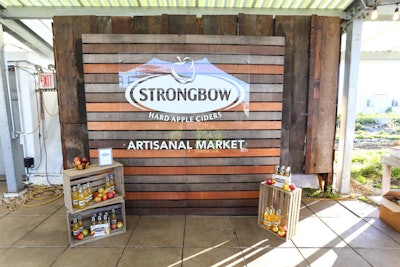 A branded step and repeat included wooden crates decorated with the Artisanal Blend bottles and the apples from which the cider is made.
