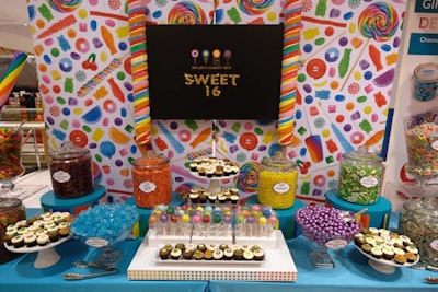 Guests were able to indulge in an array of sweet treats, including candy, cupcakes, signature lollipops, and a doughnut wall.