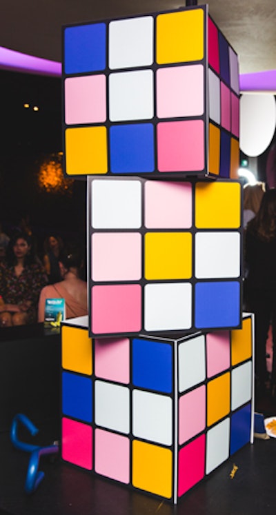A structure was created with giant Rubik's Cubes in the event's pink, blue, yellow, and white color scheme.