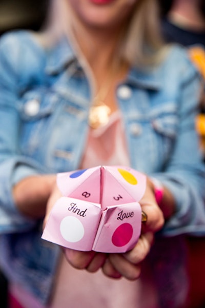 Throwback props included paper fortune-tellers in the event's color scheme.