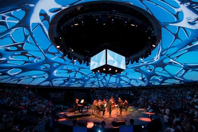 A 360-degree projection surface surrounded the “big top”-style tent.