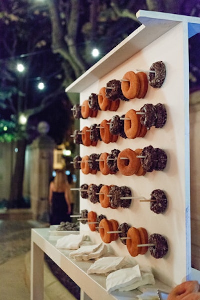 Before guests exited, they could grab a doughnut from a doughnut wall, along with to-go cups of Mexican hot chocolate that were set up outside of the venue while the dinner was taking place.