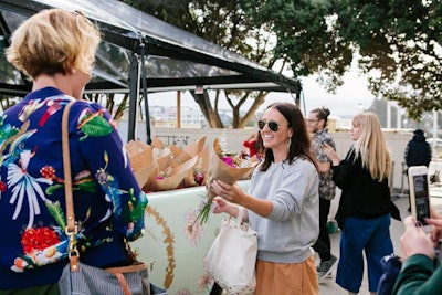 Attendees received floral takeaways at the end of the day. Other giveaways included sneakers, wireless breast pumps, and kids' lunch items.