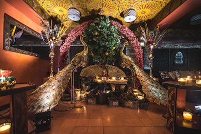 A popular photo op included a display with golden peacock statues, a Caribbean green orange tree, and bottles of Grand Marnier. The event design and decor was handled by Donna Milburn.