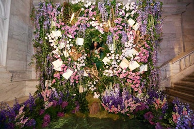 The event featured a number of floral photo ops, including one in which a woman appeared as part of the installation.
