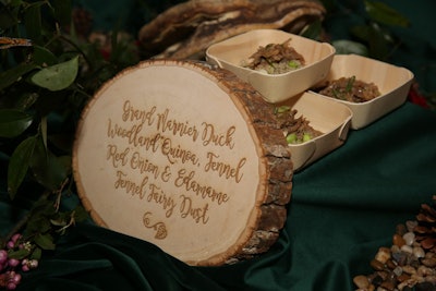 Building on the woodlands theme, catering labels at certain stations resembled tree stumps. Marcia Selden Catering & Event Planning handled catering.
