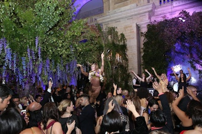 A stilt walker dressed as a deer partied with guests throughout the night.