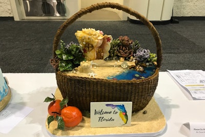 To make the basket, this competitor wove fondant and then painted it by hand. Inside the basket, Rice Krispie treats, fondant, gumpaste, and isomalt created sea creatures, flowers, succulents, and rocks.