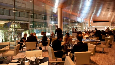 Lincoln Ristorante at Lincoln Center; View of dining room with open kitchen in background.