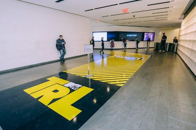 The show took over the visitors area within the lobby of the Viacom building in Times Square with graphic floor decals that resembled traffic signage.