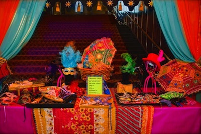 A marketplace station inspired by an exotic bazaar at the Orthopaedic Institute for Children gala was stocked with colorful accessories such as masks and fans.