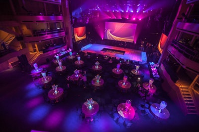 A private celebration with rounds, lounge furniture, a dance floor, and three stages featuring performances by Pitbull, Enrique Iglesias, and Rick Springfield.