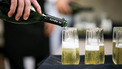 Patina Catering; Private label sparkling cuvee toast.