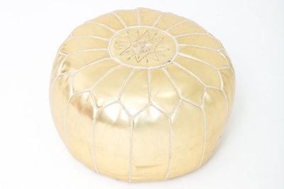 Gold Moroccan poufs are available in Los Angeles and San Francisco from Yeah Rentals. Pricing is available upon request.